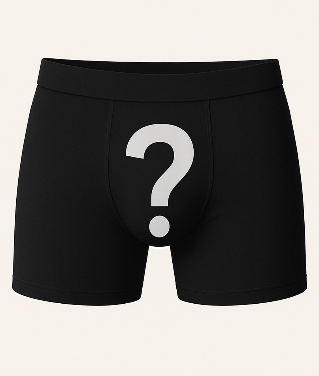 Black boxer briefs with a white question mark on a beige background